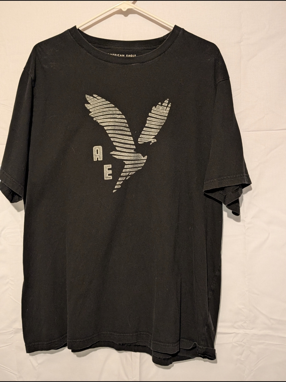 American Eagle Outfitters Black Tee with Silver Striped Eagle Graphic